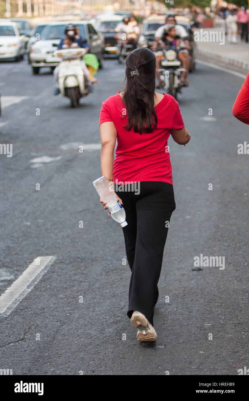 Woman,power,walk,Marine,Drive,exercise,next,to,Chowpatty,Beach,keep,fit,pollution,danger,breathing,water,bottle,Mumbai,Bombay,India,Indian,Asia,Asian, Stock Photo