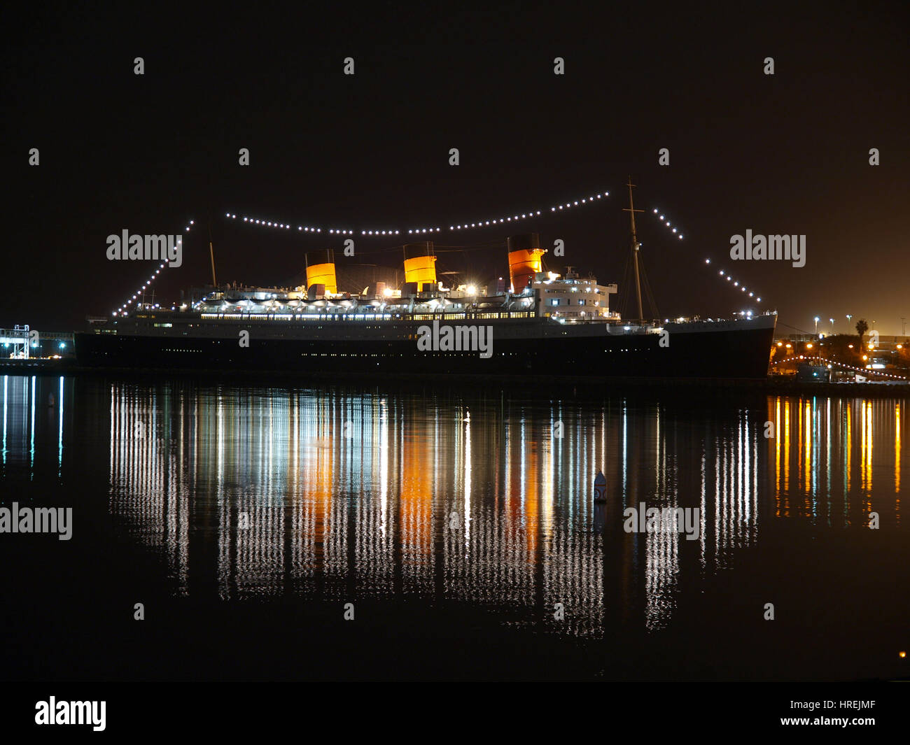 Editorial night view of the historic Queen Mary in Long Beach, California. Stock Photo