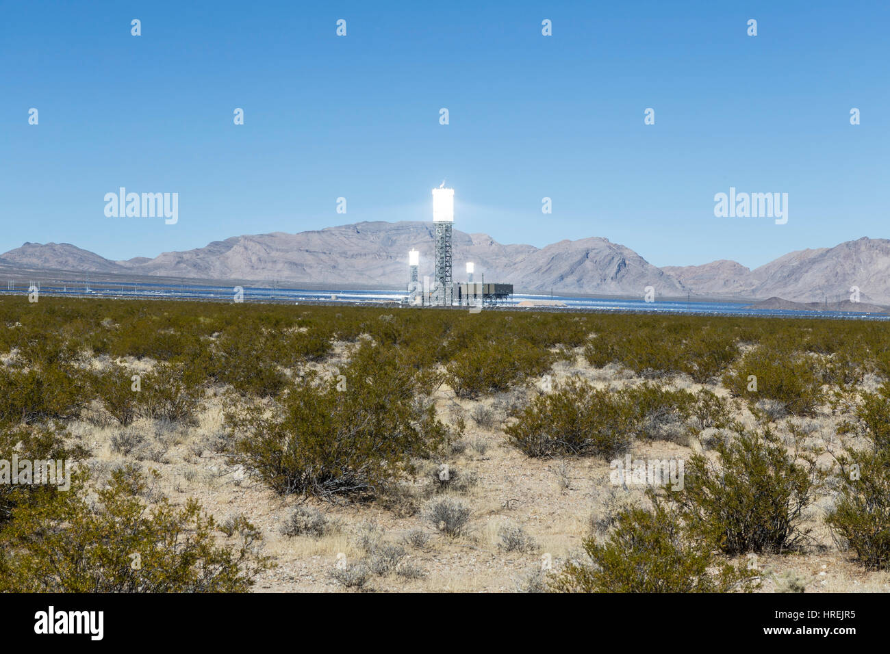 Ivanpah, California, USA - November 26, 2014:  Glowing towers at the massive 392 megawatt Ivanpah solar thermal power plant. Stock Photo