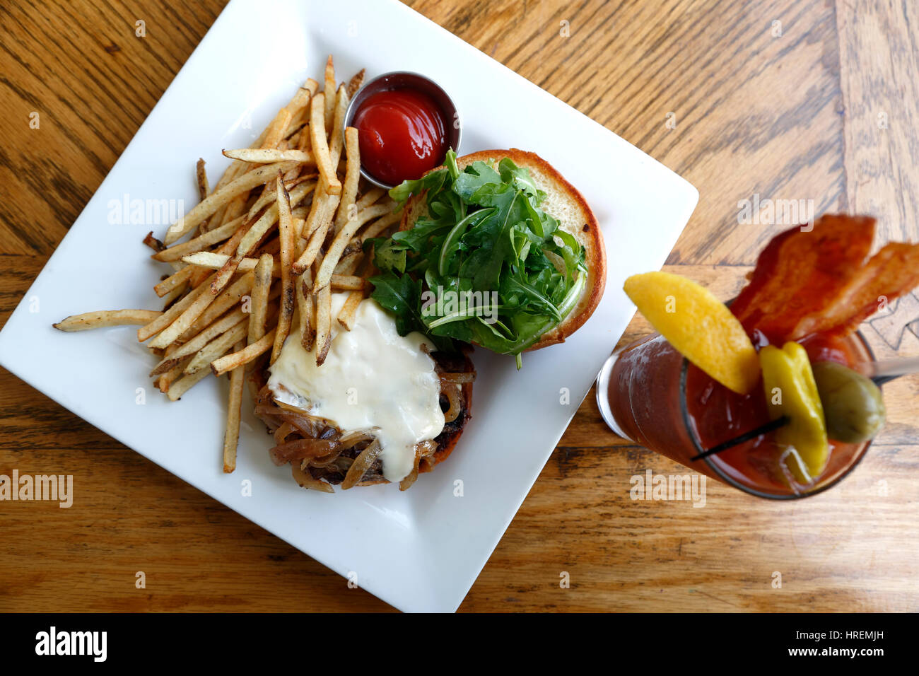 Bison Bistro Burger and fries with Bacon Bloody Mary, Dining Hall, Chautauqua Park, Boulder, Colorado USA Stock Photo