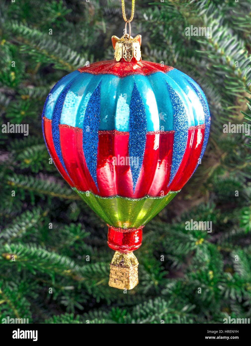 Christmas bauble hanging from a tree in the shape of a Hot Air Balloon Stock Photo