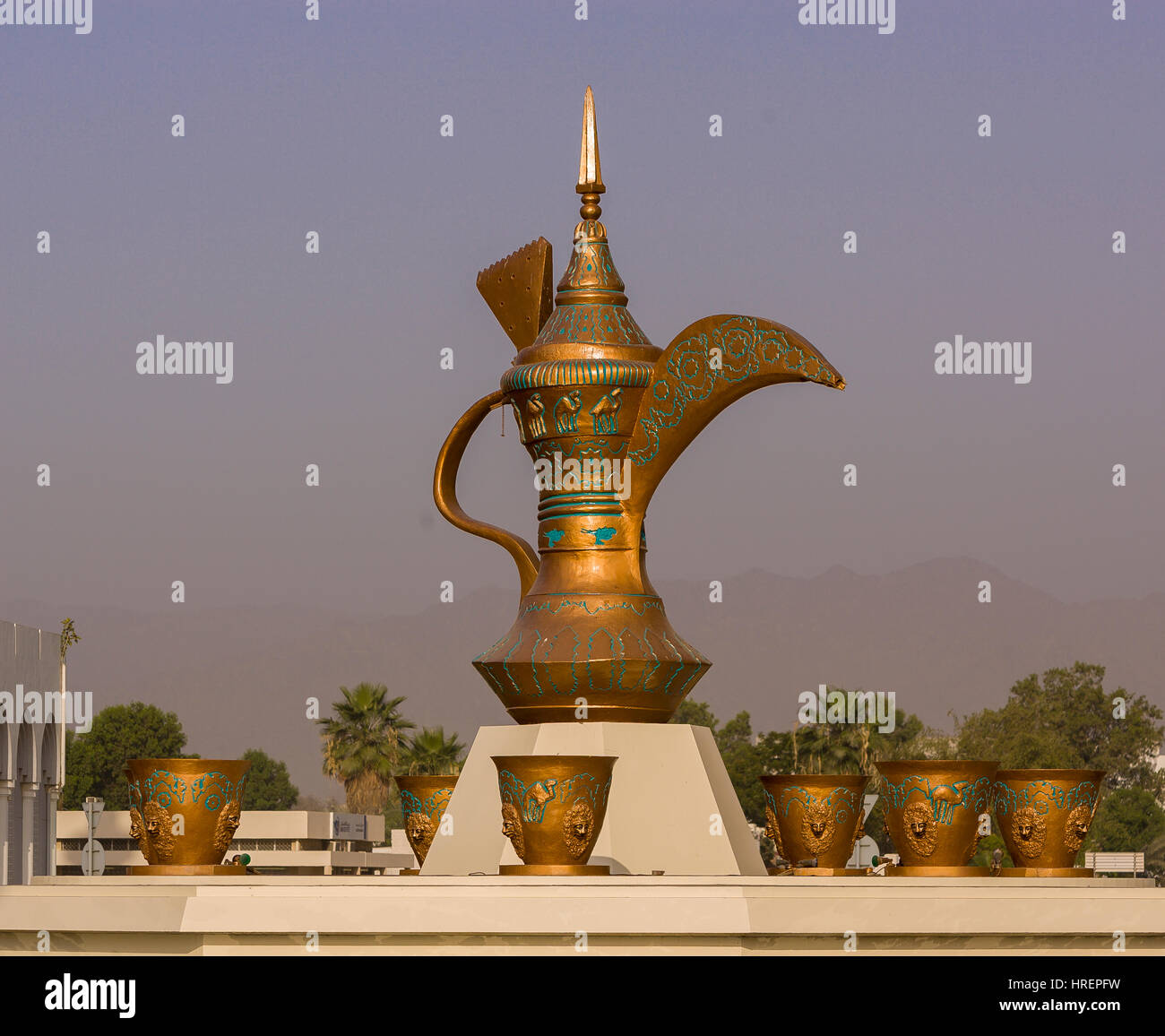 FUJAIRAH, UNITED ARAB EMIRATES - Giant coffee pot  and cups sculpture at rotary traffic circle. Stock Photo