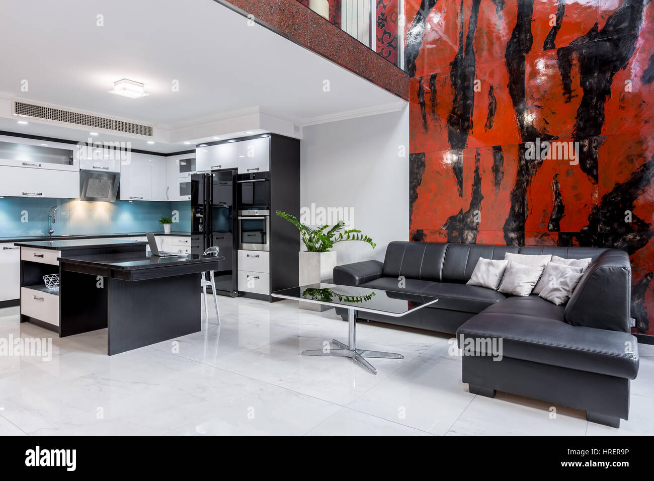 View of Interesting and modern interior of the apartment with mezzanine and ...