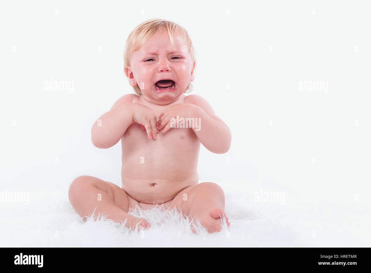 crying baby in diaper Stock Photo