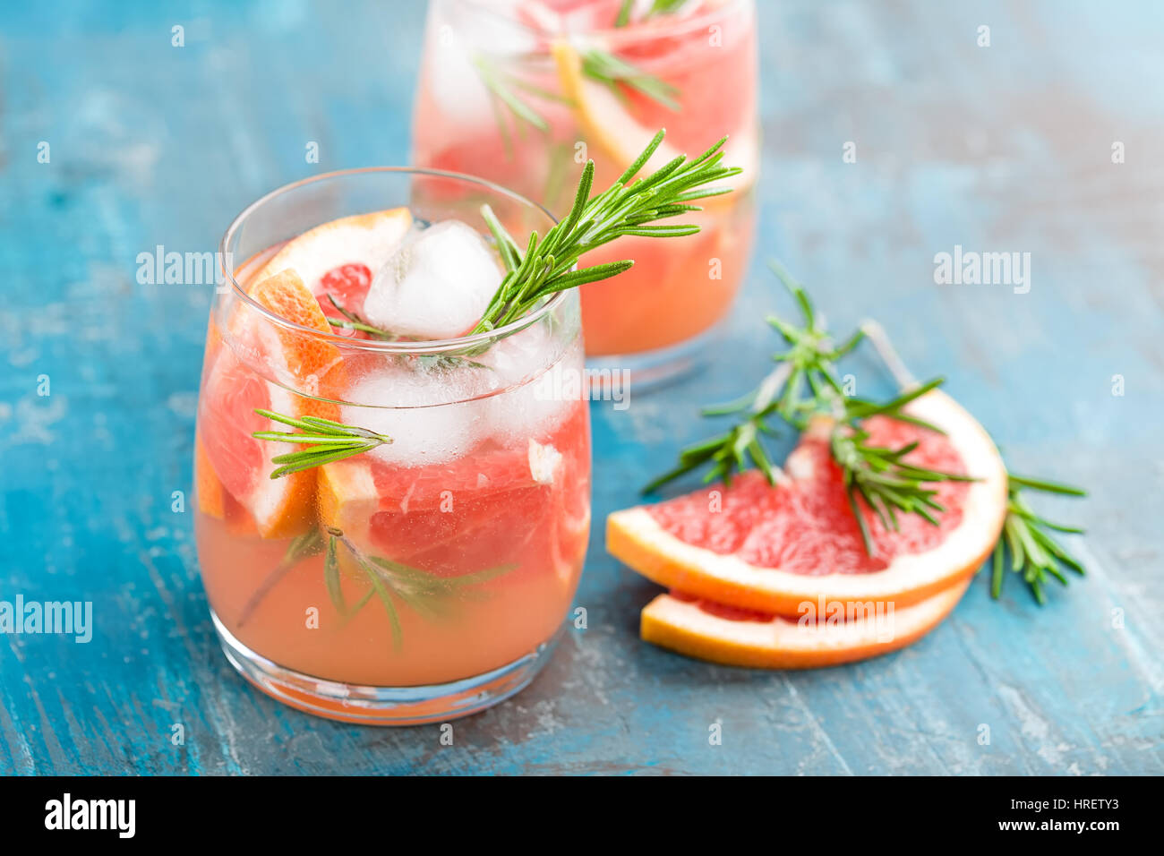 Grapefruit and rosemary gin cocktail, refreshing drink with ice Stock