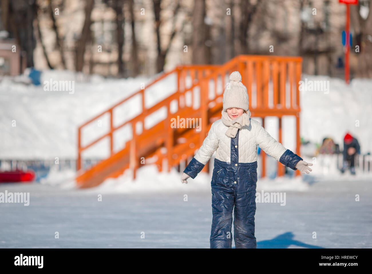 Adorable little girl skating on the icerink Stock Photo Alamy