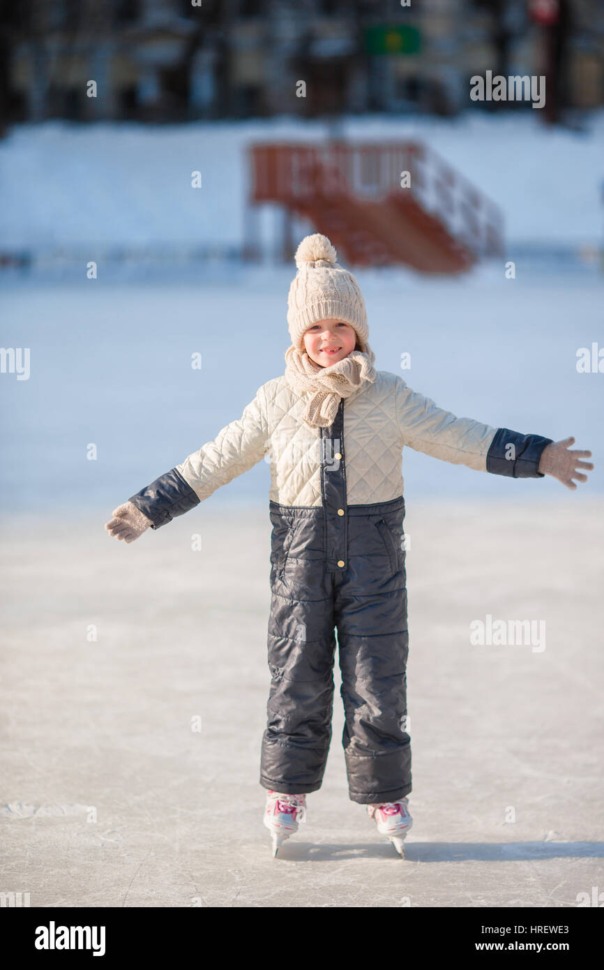 Adorable little girl skating on the icerink Stock Photo Alamy