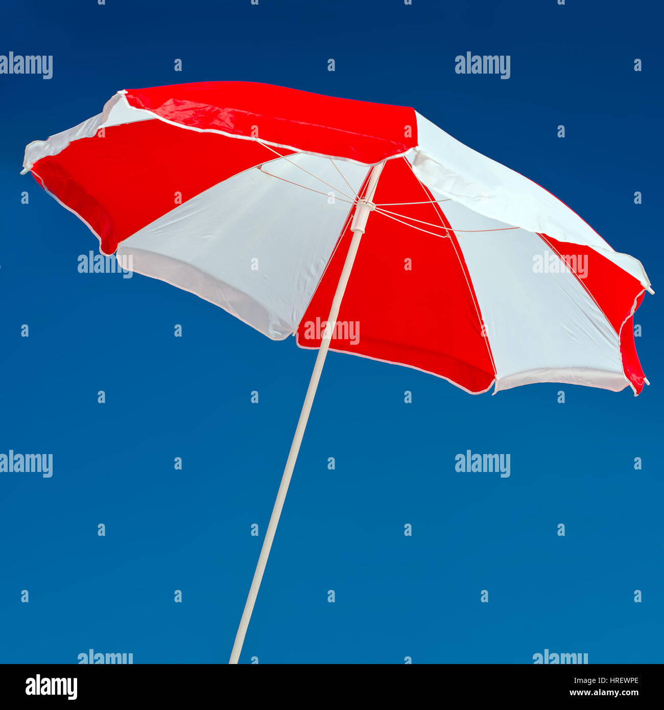 Red and white beach parasol hires stock photography and images Alamy