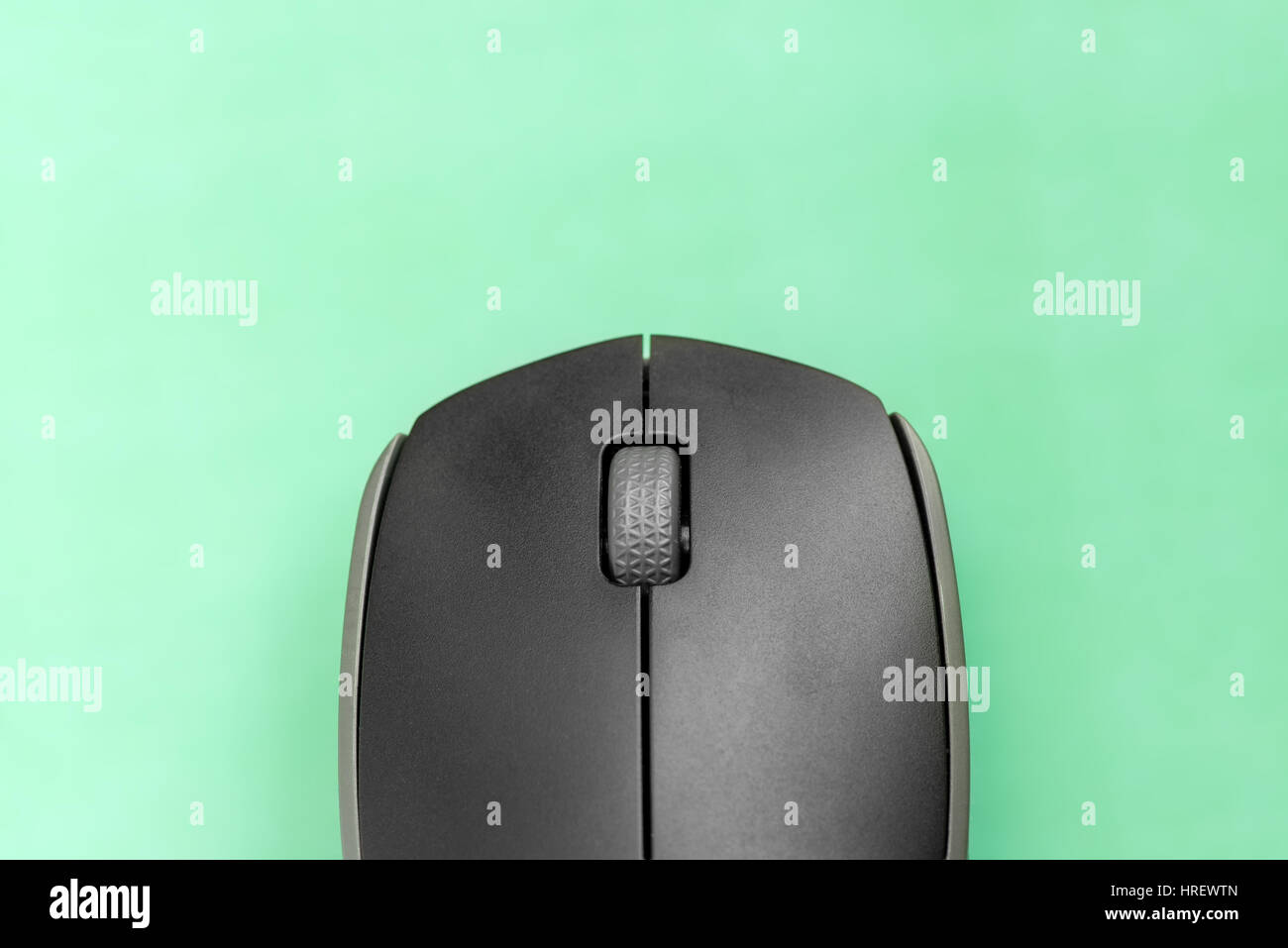 Computer mouse on green background Stock Photo