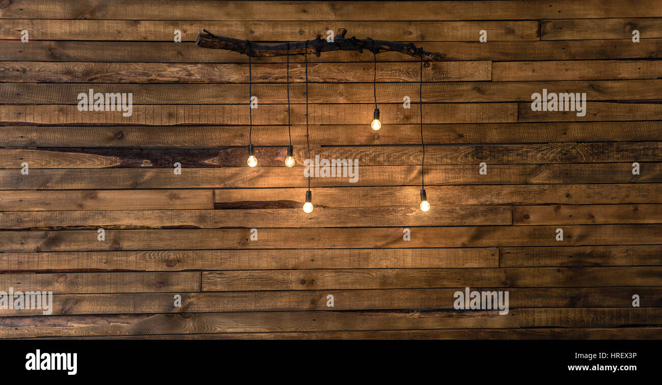 Light bulbs on dark Wooden Background real image Stock Photo - Alamy