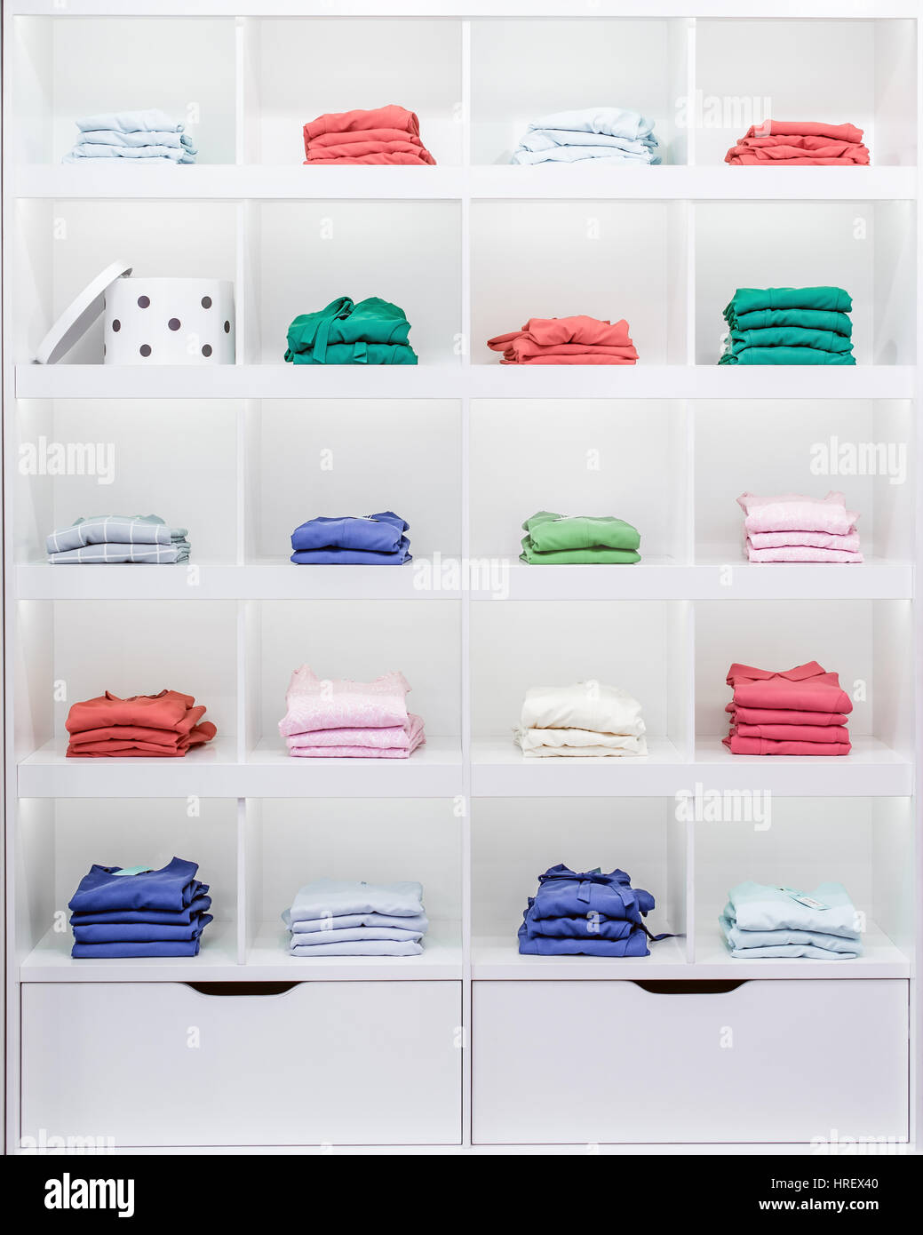 Shelves with clothes, showcase Stock Photo
