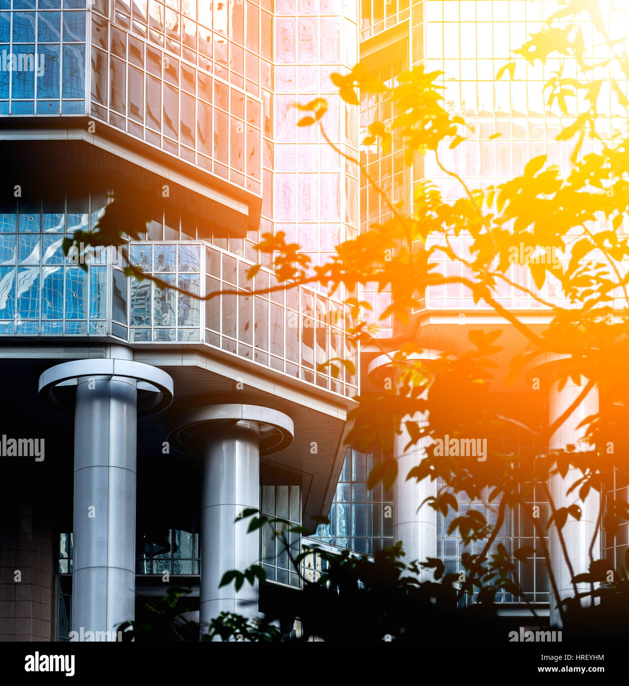 Modern office building close up in sunlight Stock Photo - Alamy