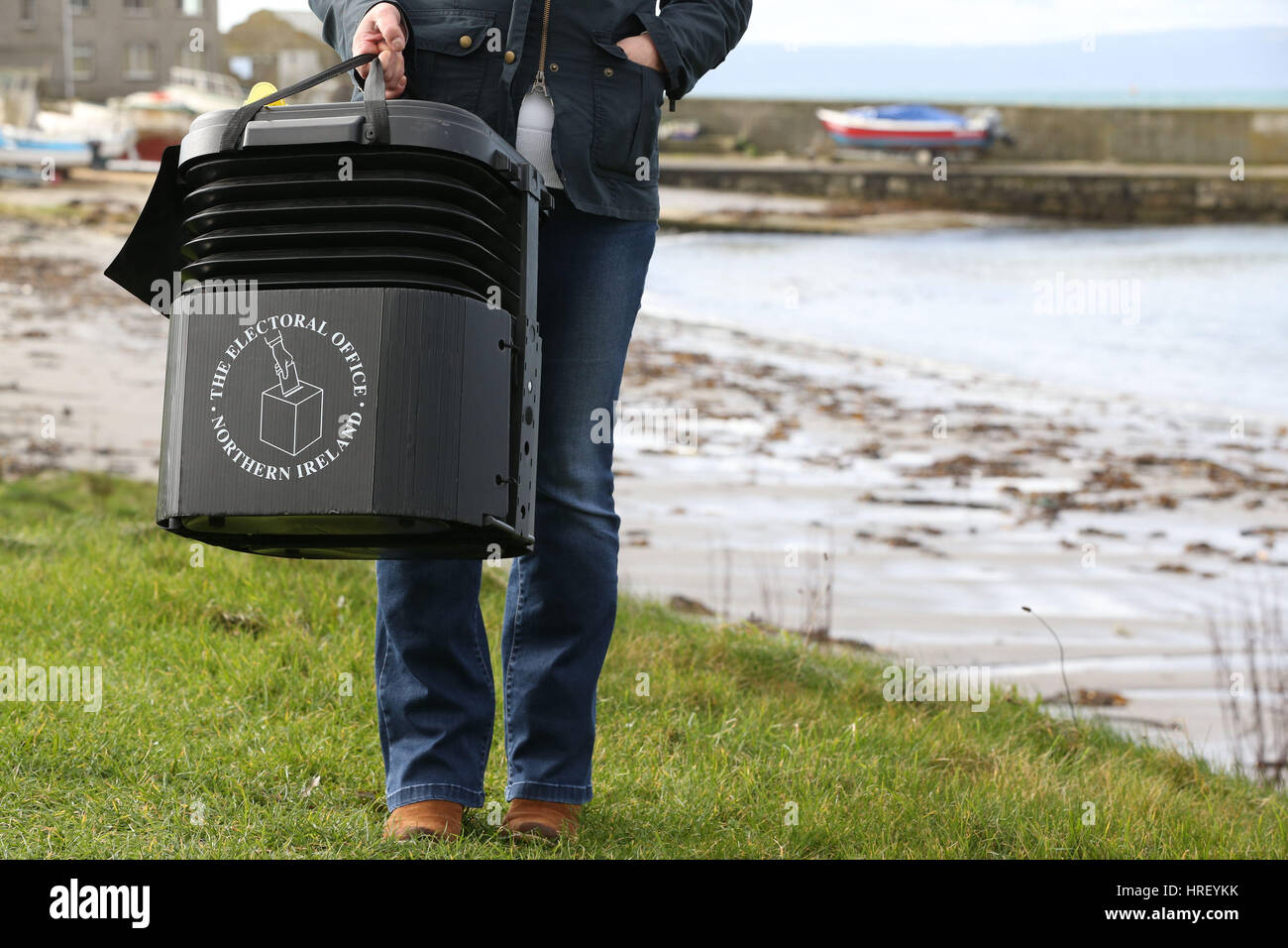 Senior presiding officer and polling station manager Teresa McCurdy on Rathlin Island, off the north east coast of Northern Ireland, with the ballot box in which the island's population of just over 100 people will cast their votes during Thursday Assembly election. Stock Photo