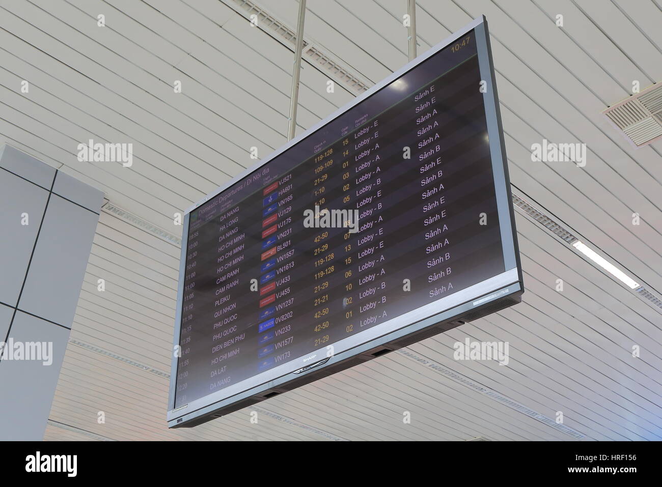 Departure information displays flight schedules at Hanoi International airport in Hanoi Vietnam. Stock Photo