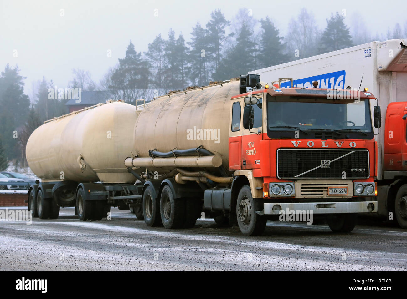 SALO, FINLAND - DECEMBER 16, 2016: Classic Volvo F1225 tank truck of Hovi parked on a truck stop in foggy winter weather. Stock Photo