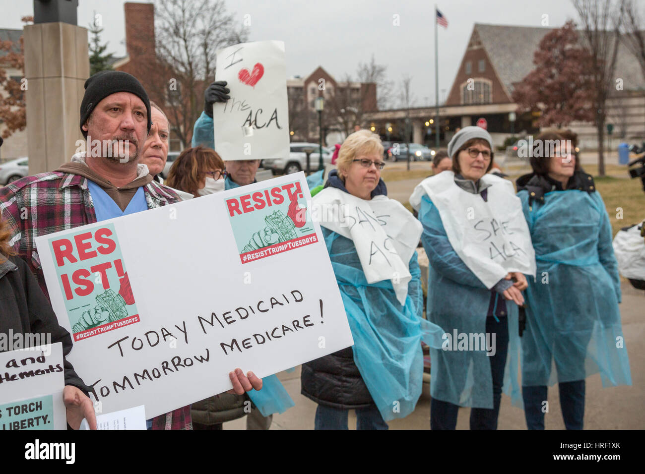 Birmingham, Michigan - With some wearing hospital gowns, people rally to save affordable health care. They were protesting Republicans' plan to repeal Stock Photo