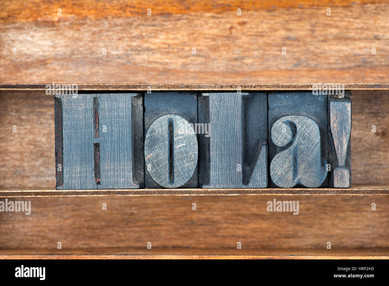 hola - Spanish greeting word made from vintage letterpress type on wooden tray Stock Photo