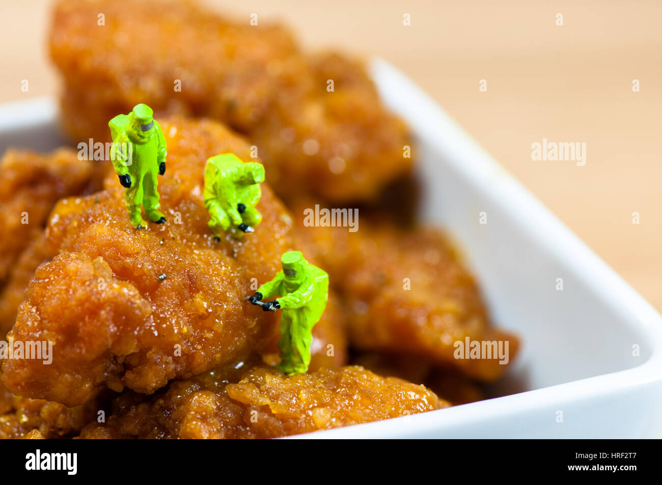 Group of scientists inspecting chicken nuggets. Unhealthy food concept
