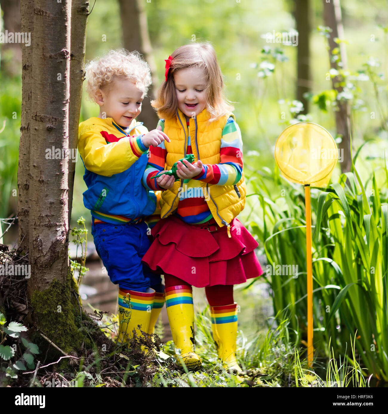 https://c8.alamy.com/comp/HRF3K6/children-playing-outdoors-preschool-kids-catching-frog-with-net-boy-HRF3K6.jpg