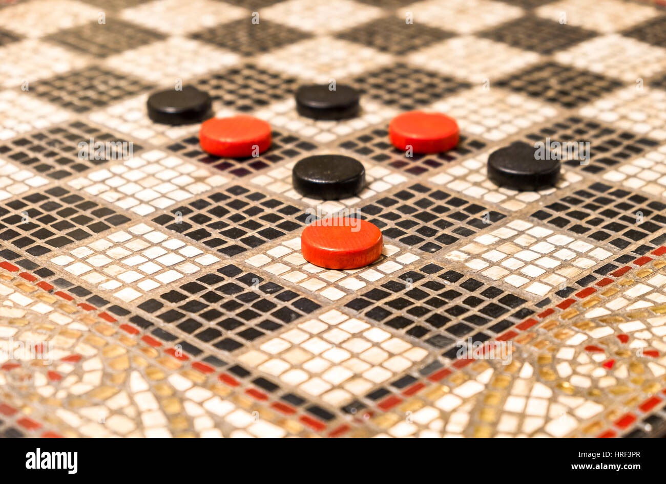Black And Red Checkers On A Black And White Board Made Of Small Pieces Of Stone Stock Photo Alamy
