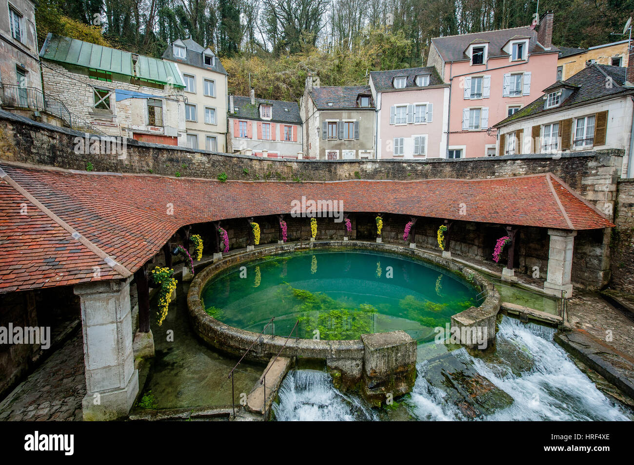 Fosse Dionne (Dionne Pit) is an ancient wellspring located in Tonnerre district of France.   This natural spring has been built up into a grotto since Stock Photo
