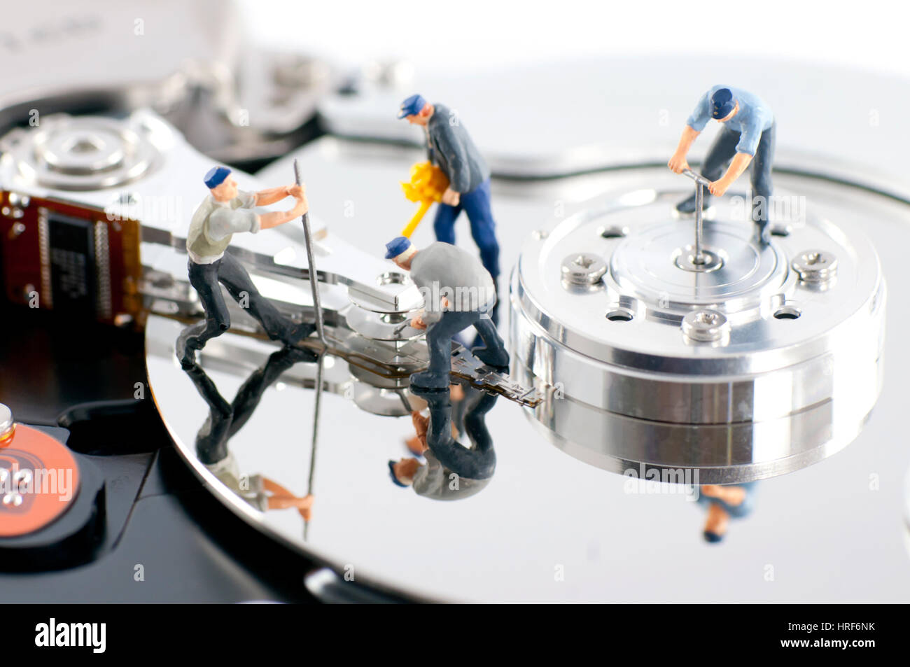 Group of workers repair hard drive. Hard drive repair concept Stock ...