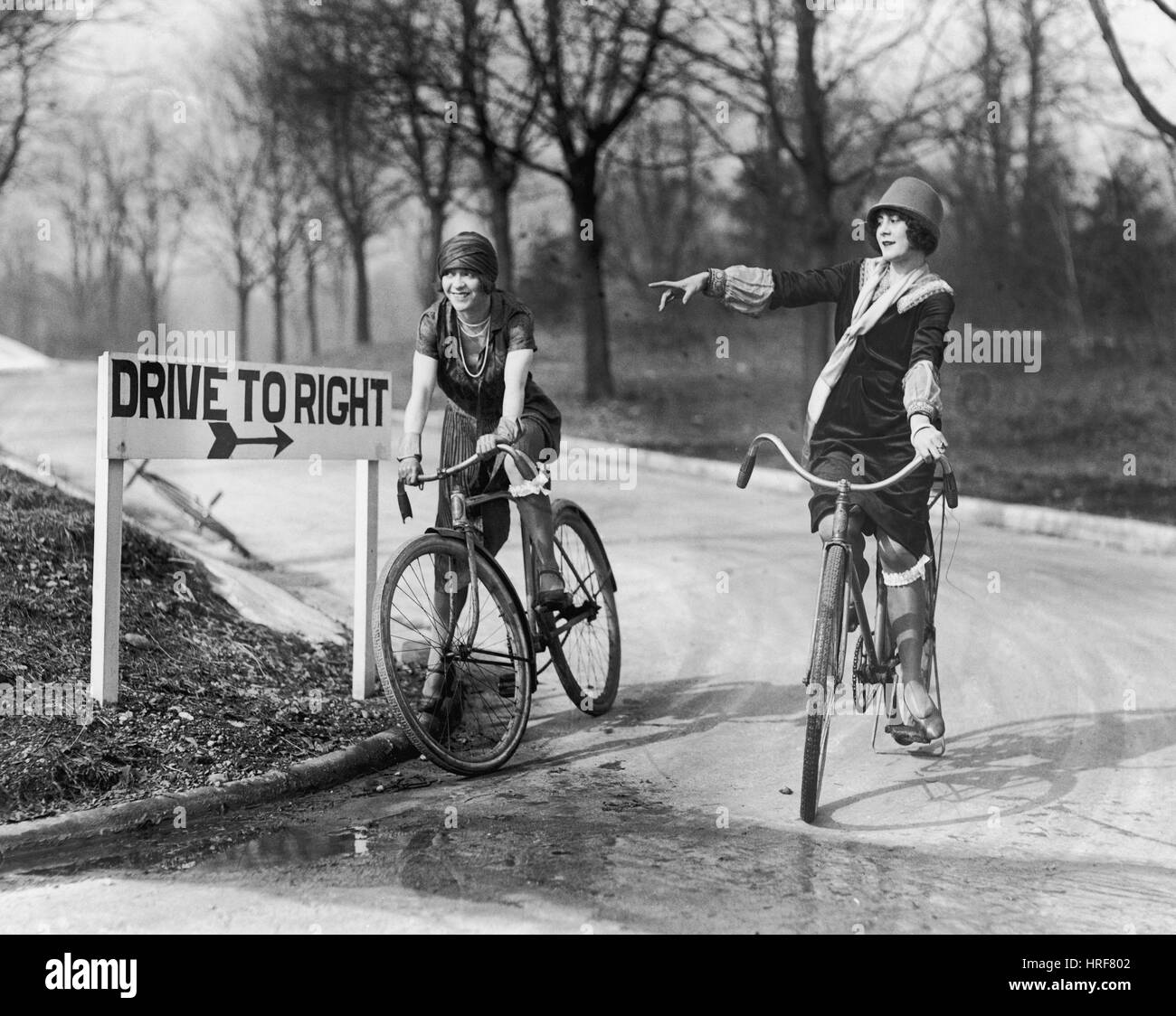 Flappers Bicycling, 1925 Stock Photo