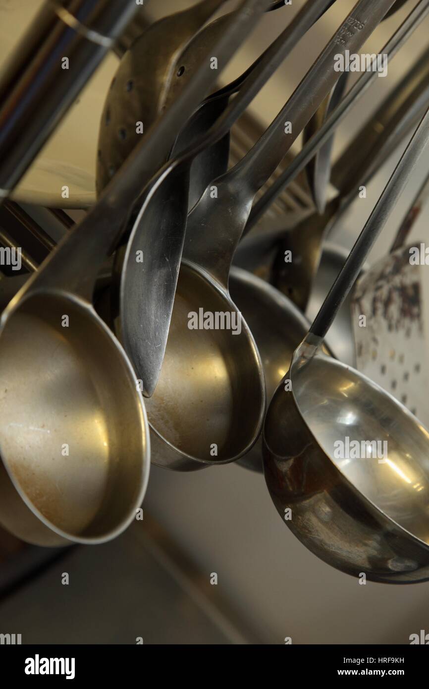 https://c8.alamy.com/comp/HRF9KH/a-selection-of-chefs-ladles-hanging-in-a-kitchen-cooking-implements-HRF9KH.jpg