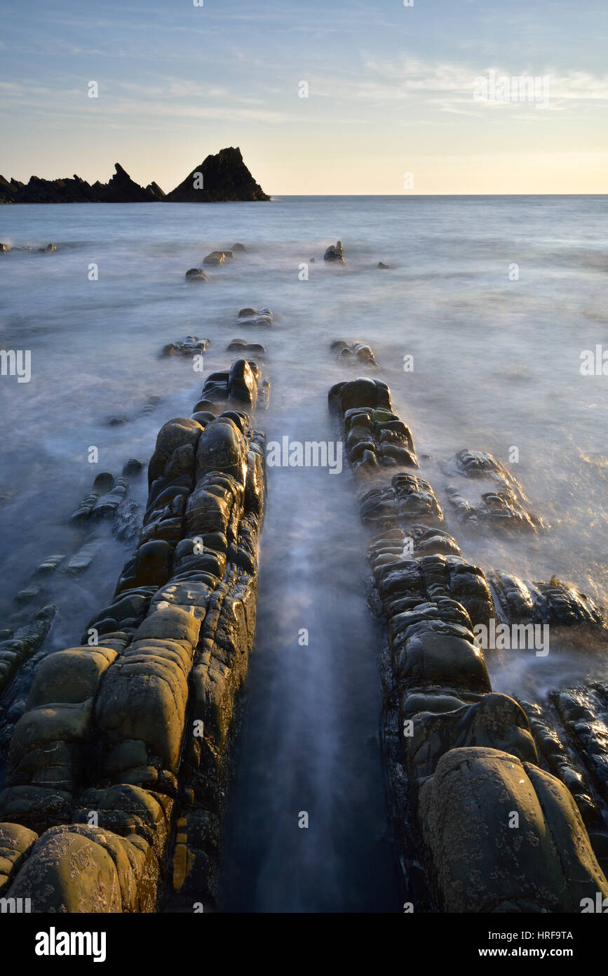 Rocks in the sea, rocky coast, Atlantic Coast, Hartland Quay, Devon, United Kingdom Stock Photo
