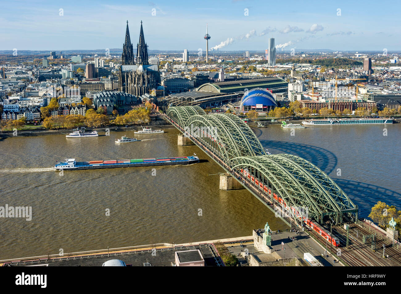 View over the river Rhine, Cologne's historic centre, Cargo Ship, Museum Ludwig, Cologne Cathedral, Hohenzollern Bridge, Central Stock Photo