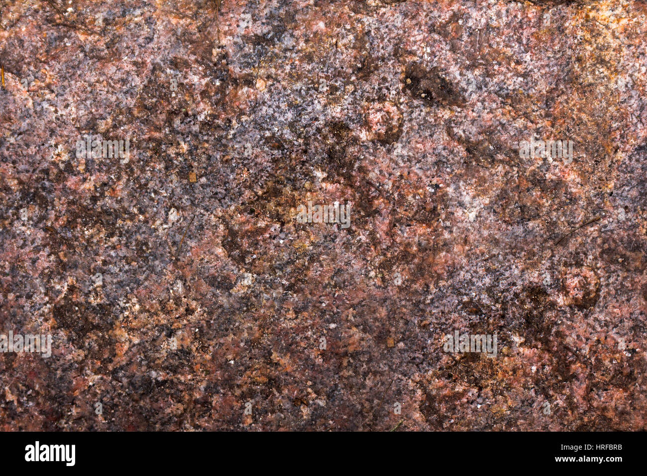 Natural raw red granite dirty surface, rock surface background Stock