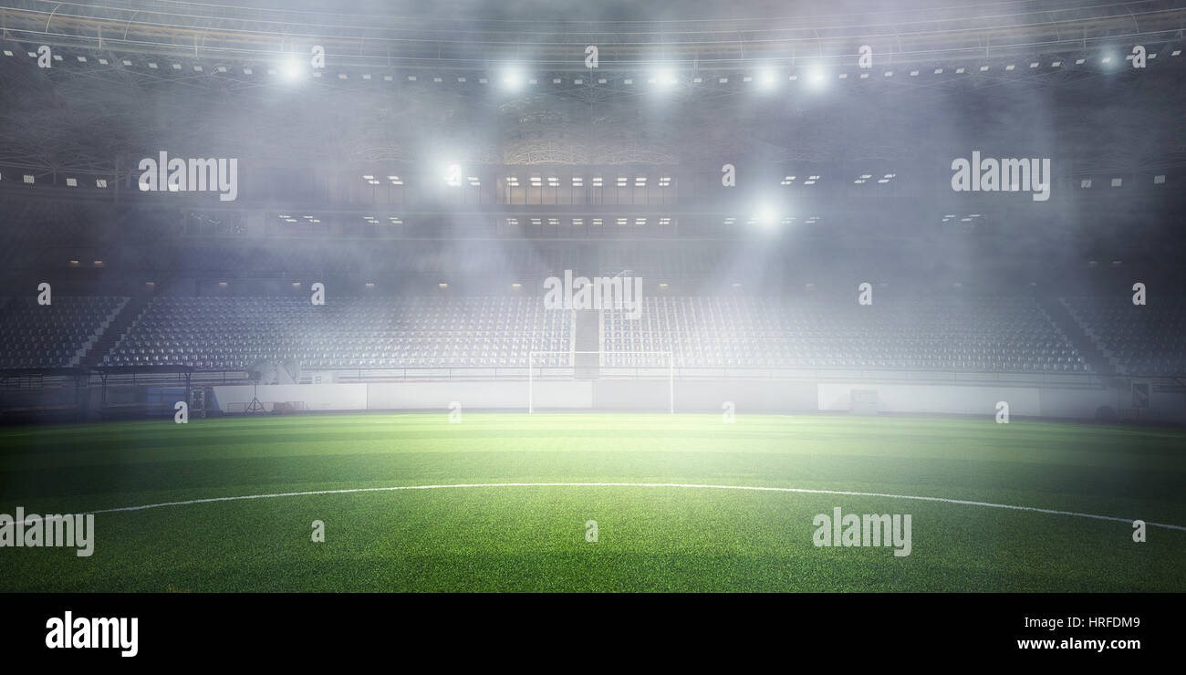 Empty football stadium in fog and spotlights. Mixed media Stock Photo