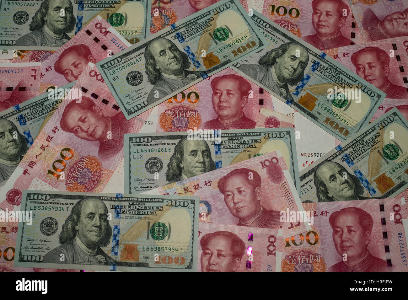 US dollars and Chinese renminbi banknotes (bills) Stock Photo