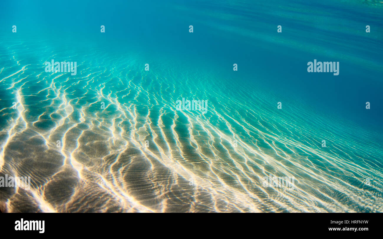 Underwater scene with light patterns on the Ocean floor. Stock Photo