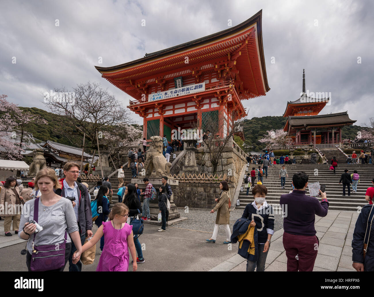 Tourists walking by Niomon Gate of Kiyomizu dera, Buddhist Temple, in Kyoto, Japan Stock Photo