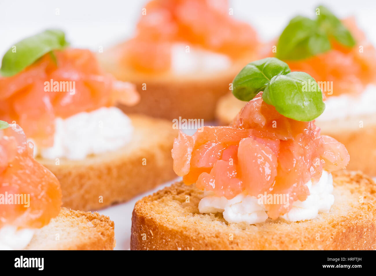 Canapes with smoked salmon, cream cheese and basil Stock Photo Alamy