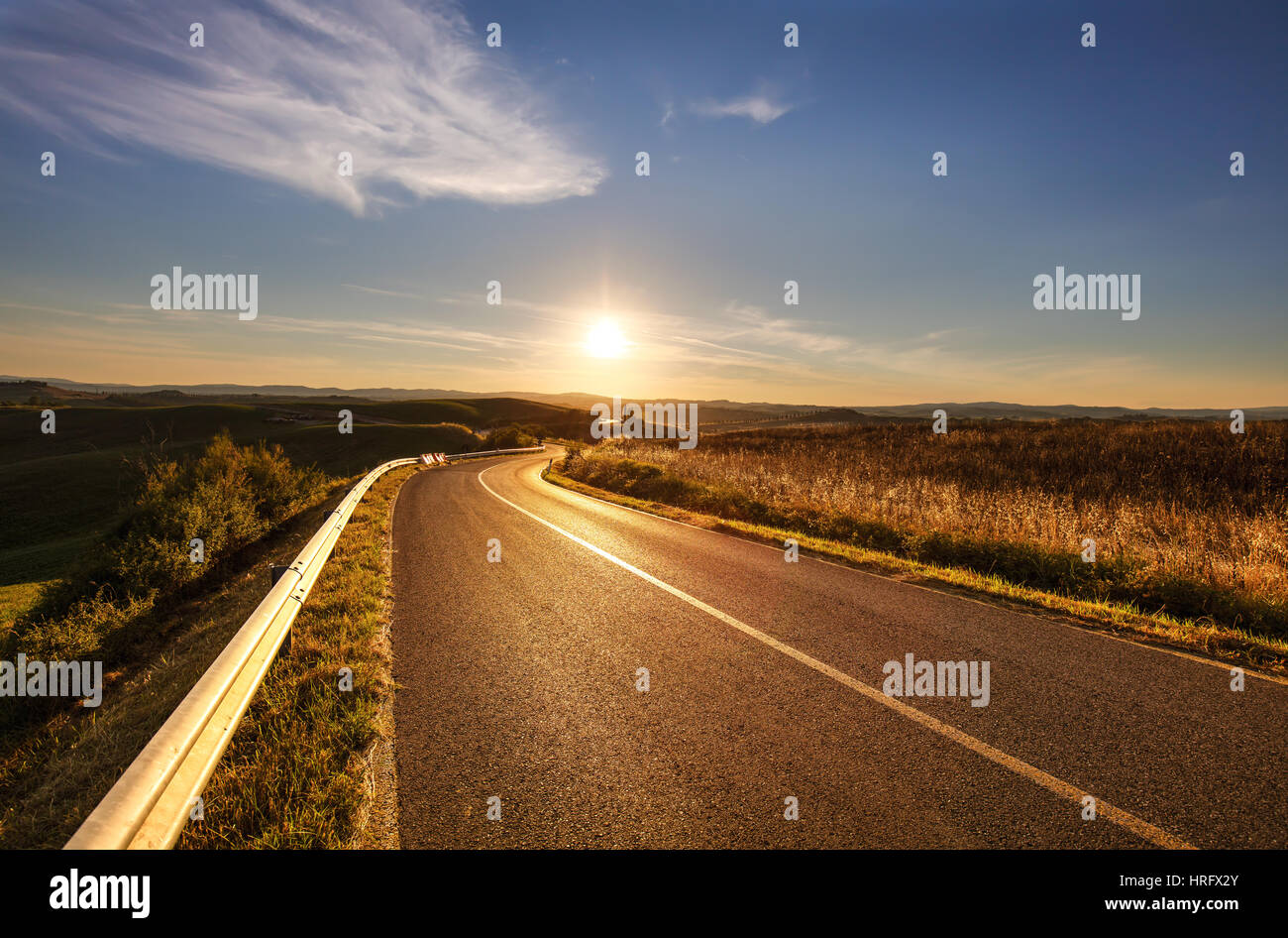 Tuscany, straight road rural landscape of Tuscany with yellow and green field. Italy. Europe. Stock Photo