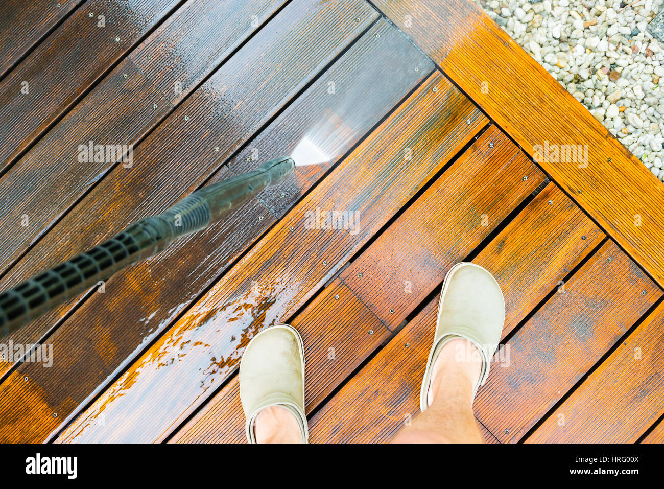 cleaning terrace with a power washer high water pressure cleaner on