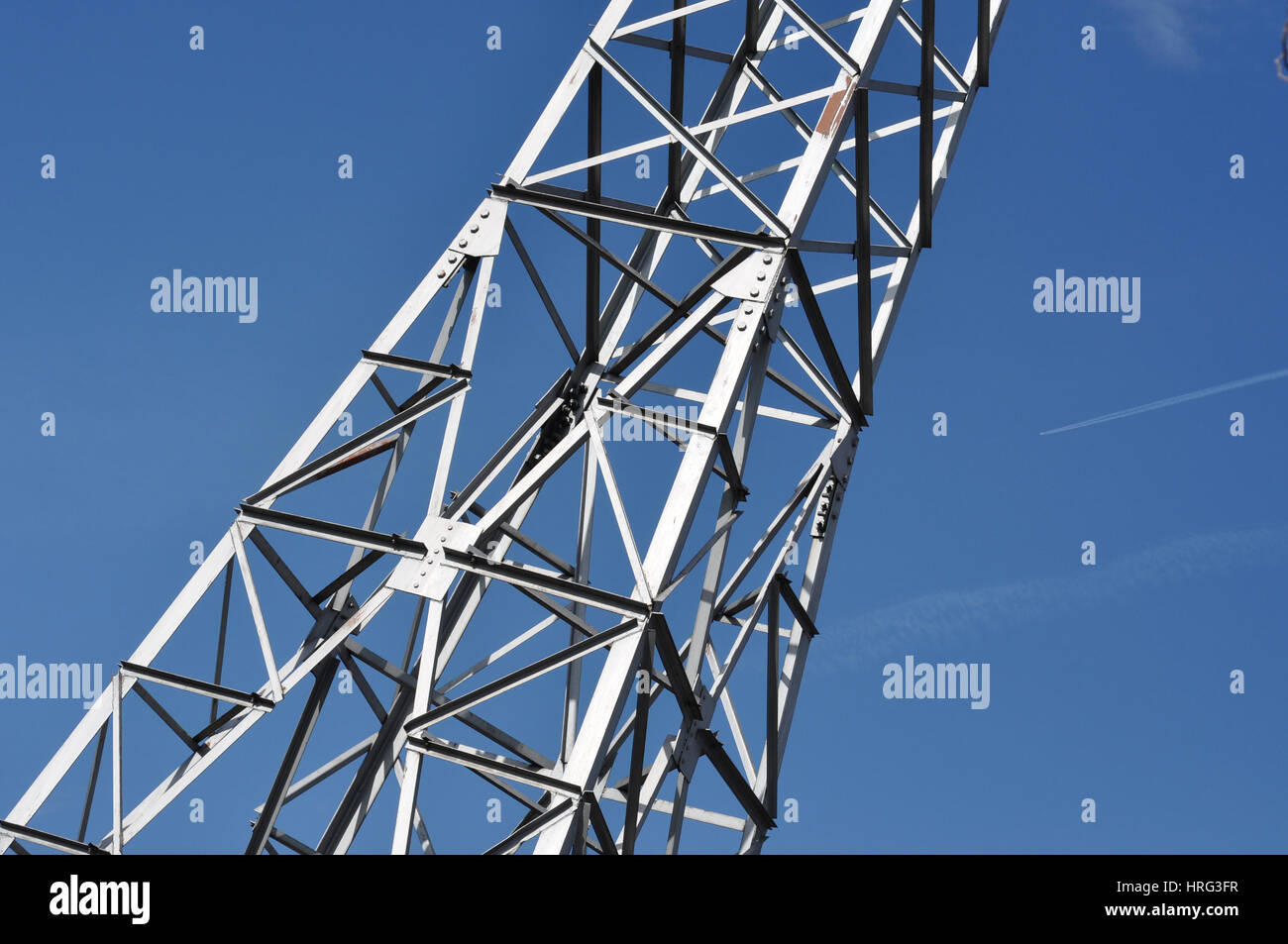 Electricty power tower against blue sky Stock Photo - Alamy