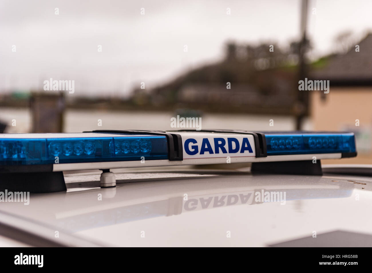 Garda/Irish Police sign and blue lights on a Garda/Police car with copy space. Stock Photo