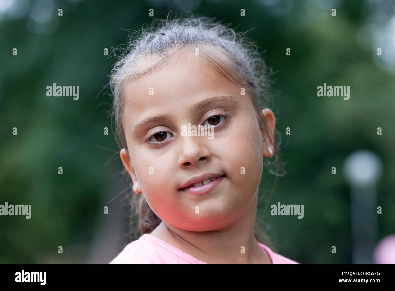 Girl playing in the park, Selective focus and small depth of field ...
