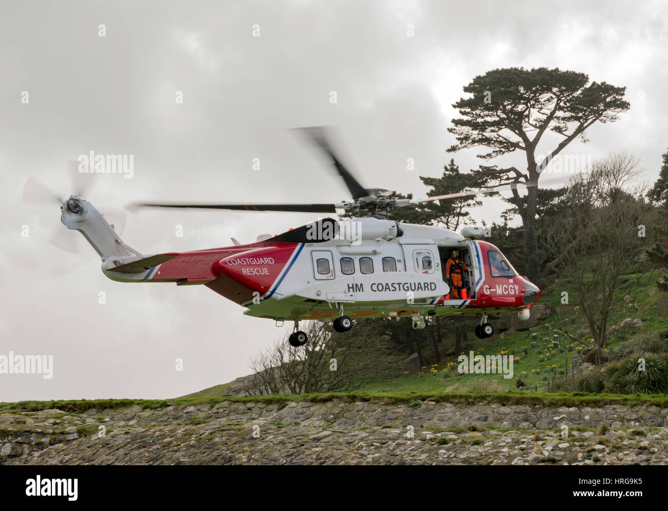 St Michaels Mount, Cornwall, UK. 1st March 2017. Newquay based coastguard Helicopter on approach to land at St Michaels Mount, Cornwall,UK Credit: Bob Sharples/Alamy Live News Stock Photo