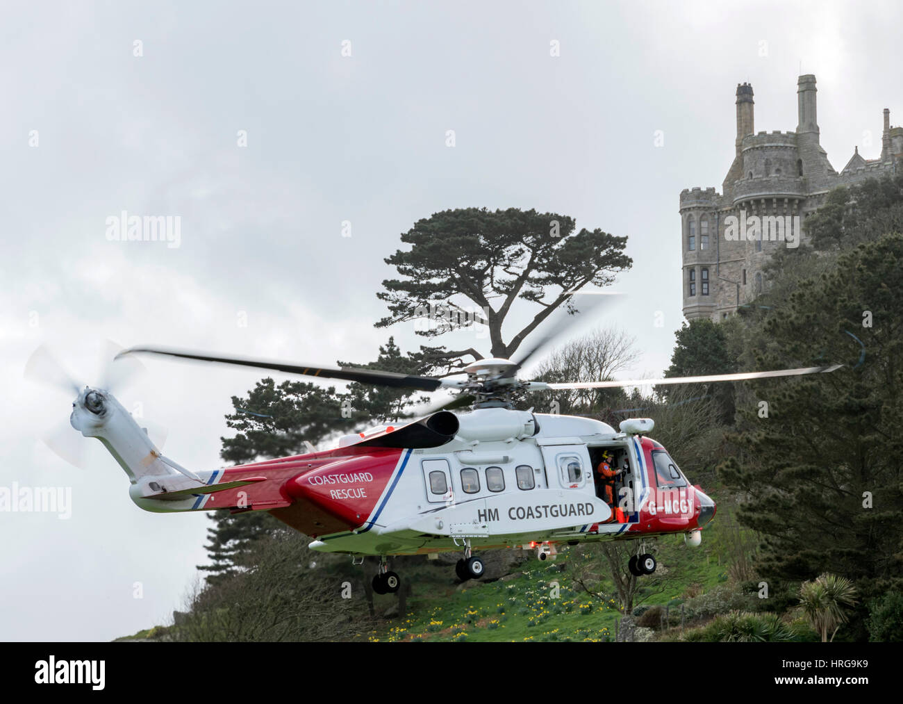 St Michaels Mount, Cornwall, UK. 1st March 2017. Newquay based coastguard Helicopter on approach to land at St Michaels Mount, Cornwall,UK Credit: Bob Sharples/Alamy Live News Stock Photo