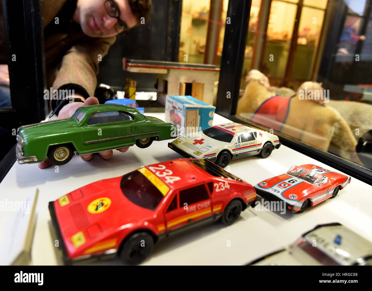 Kleessen, Germany. 01st Mar, 2017. Museum director Frithjof Hahn shows a metal car from the VEB Mechanical toys Brandenburg (MSB) which made tin cars until 1989 at the toy museum in Kleessen, Germany, 01 March 2017. After the winter break, the museum will open with the special exhibition 'Spielzeugauto' (lt.'Toy Cars'). Cars from the 1920s to the last GDR models and brass cars from Brandenburg will complete the exhibition of railways, construction kits and dolls' houses. Photo: Bernd Settnik/dpa-Zentralbild/dpa/Alamy Live News Stock Photo