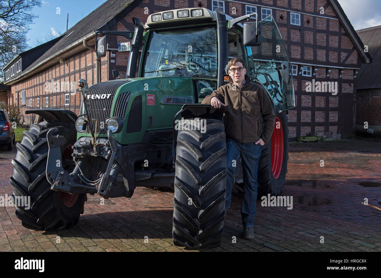 Wildeshausen, Germany. 24th Feb, 2017. Farmer Niklas Behrens standing