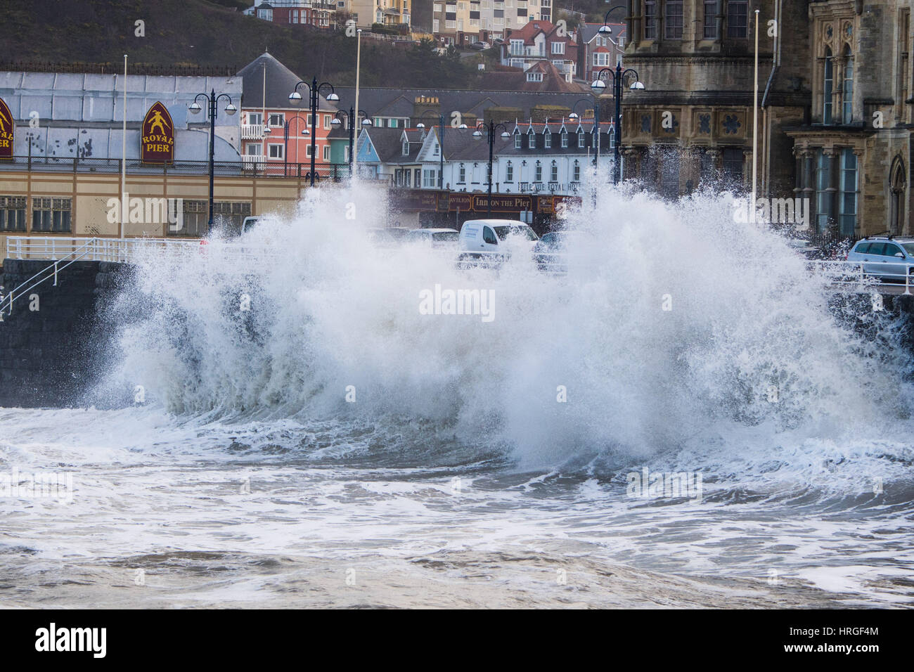 Aberystwyth, Wales, UK. 2nd March 2017.  UK Weather: After a night of gale force winds, thunderstorms and hailstones,  the morning’s 5.4m high spring tide bring mountainous high waves to batter the promenade and sea defences in Aberystwyth  on the Cardigan Bay coast of West Wales    Credit: keith morris/Alamy Live News Stock Photo