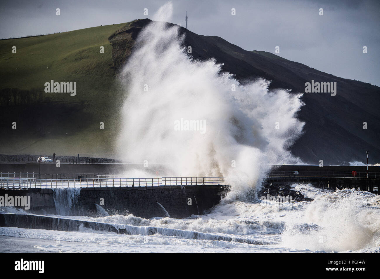 Aberystwyth, Wales, UK. 2nd March 2017.  UK Weather: After a night of gale force winds, thunderstorms and hailstones,  the morning’s 5.4m high spring tide bring mountainous high waves to batter the promenade and sea defences in Aberystwyth  on the Cardigan Bay coast of West Wales    Credit: keith morris/Alamy Live News Stock Photo