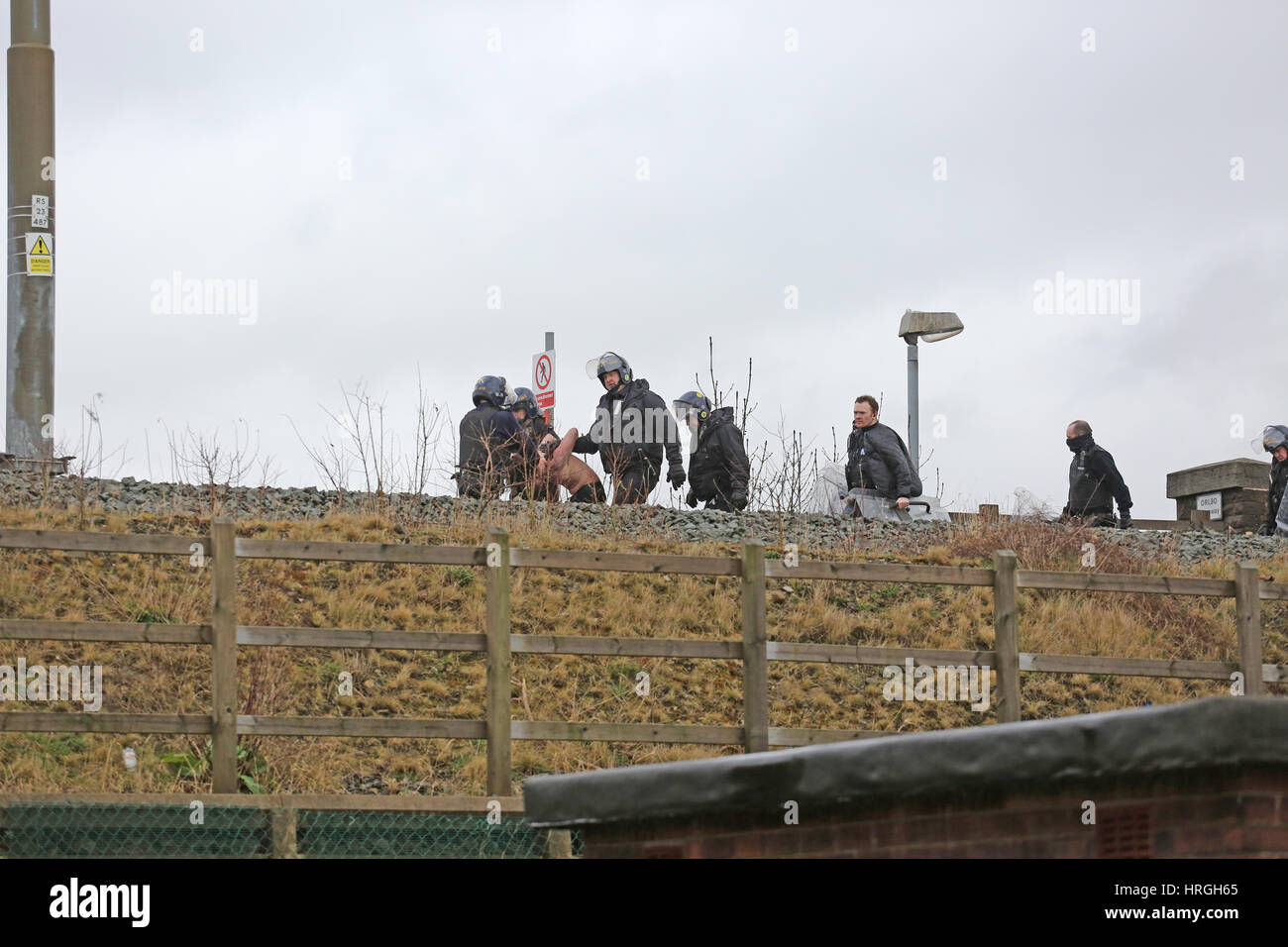 Newbold, Rochdale, UK. 2nd Mar, 2017. The Tactical Aid Unit arrest a man after an incident on tram lines at Newbold, Rochdale, 2nd March, 2017 Credit: Barbara Cook/Alamy Live News Stock Photo