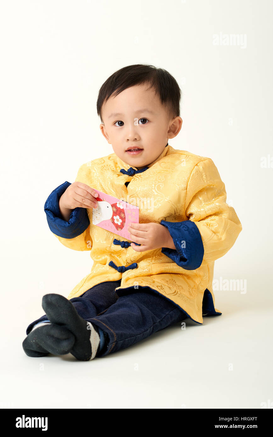 Chinese baby boy in traditional Chinese New Year outfit celebrating ...
