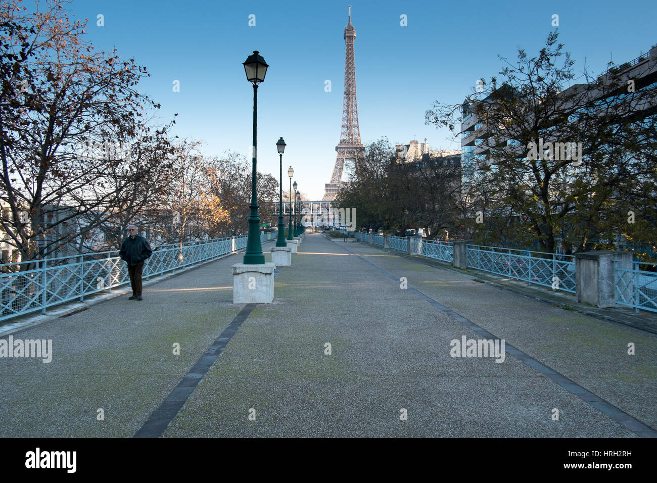 walk on the Promenade de Quai Grenelle on a chilly morning, blue sky, Eiffel Tower in background Stock Photo